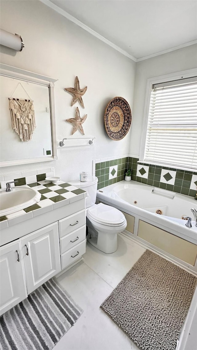 bathroom with a tub to relax in, vanity, crown molding, tile patterned flooring, and toilet