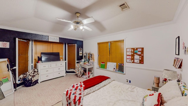 bedroom featuring carpet flooring, ceiling fan, and ornamental molding