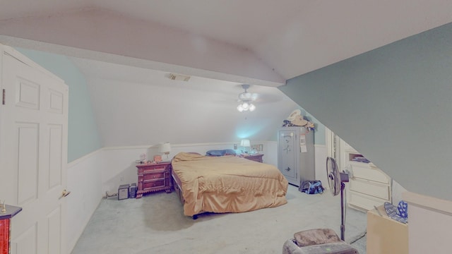 carpeted bedroom featuring ceiling fan and vaulted ceiling