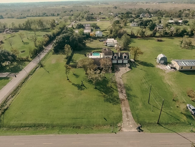 birds eye view of property featuring a rural view