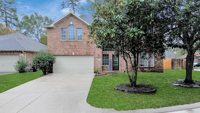 view of front of property with a garage and a front lawn