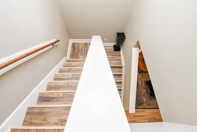 staircase featuring hardwood / wood-style floors