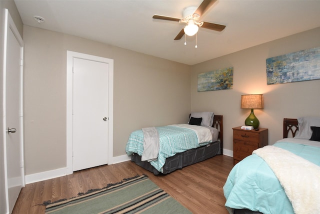 bedroom featuring ceiling fan and hardwood / wood-style flooring