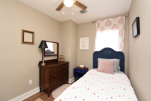 bedroom with light hardwood / wood-style floors and ceiling fan