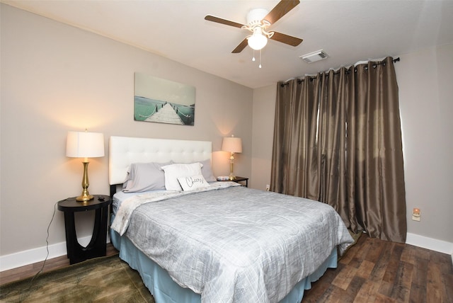 bedroom featuring dark hardwood / wood-style floors and ceiling fan