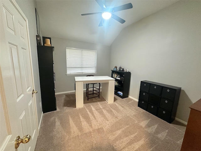 home office with ceiling fan, light colored carpet, and lofted ceiling