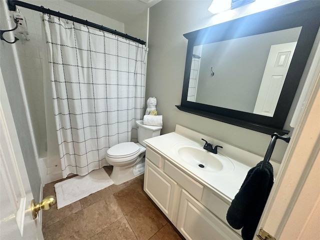 full bathroom featuring tile patterned flooring, vanity, toilet, and shower / bathtub combination with curtain