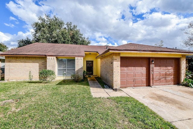 ranch-style house with a garage and a front yard