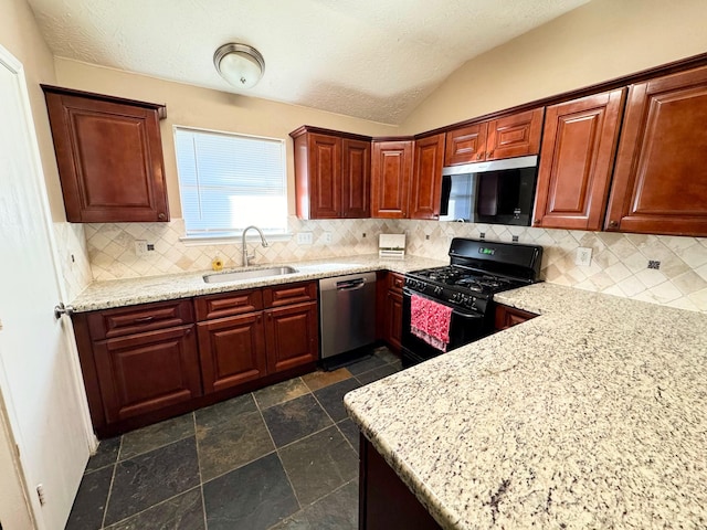 kitchen with decorative backsplash, stainless steel appliances, light stone counters, and sink