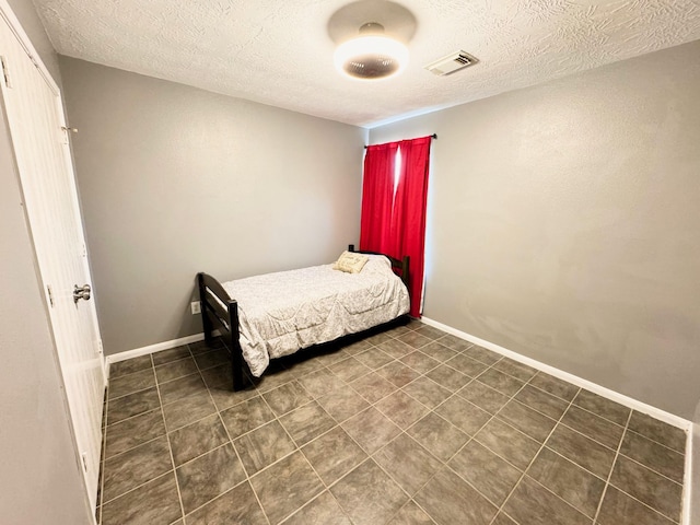 bedroom with a textured ceiling