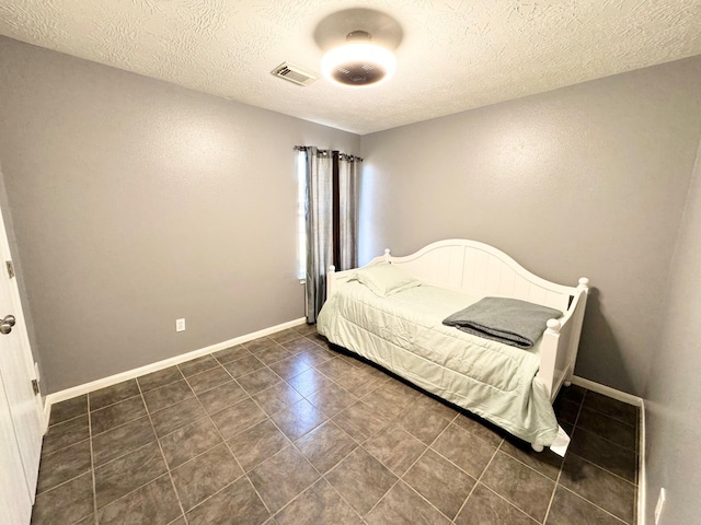 bedroom with a textured ceiling