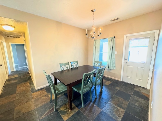 dining room featuring a chandelier