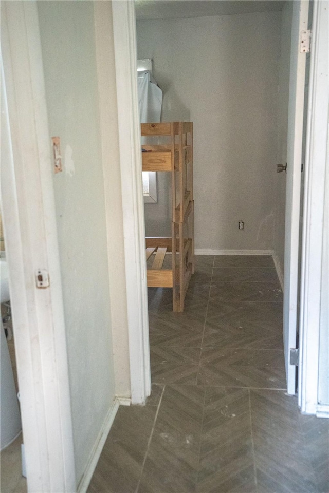 hallway with dark parquet floors