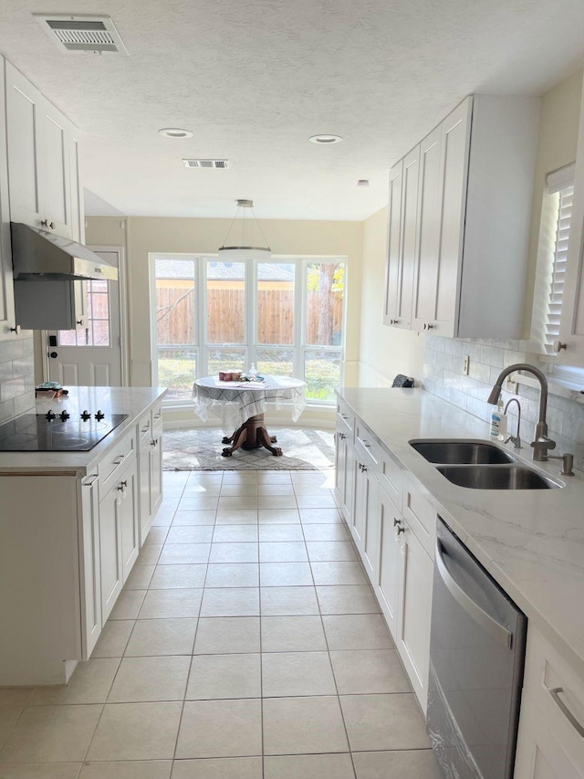 kitchen with black electric cooktop, white cabinetry, dishwasher, and sink