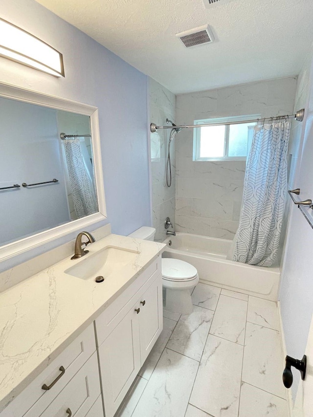 full bathroom with shower / bath combo with shower curtain, vanity, a textured ceiling, and toilet