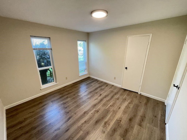 spare room with hardwood / wood-style floors