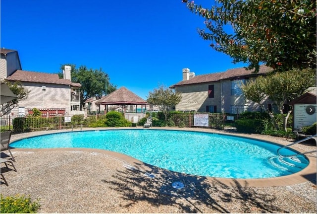 view of swimming pool featuring a gazebo