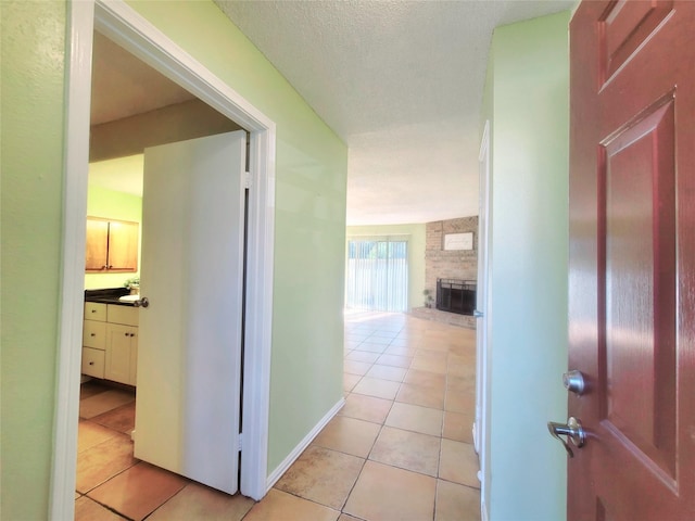 hallway featuring light tile patterned floors