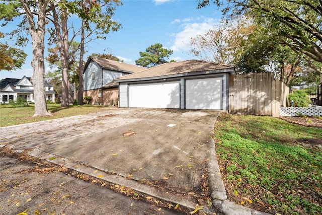 view of front of house featuring a garage and an outdoor structure