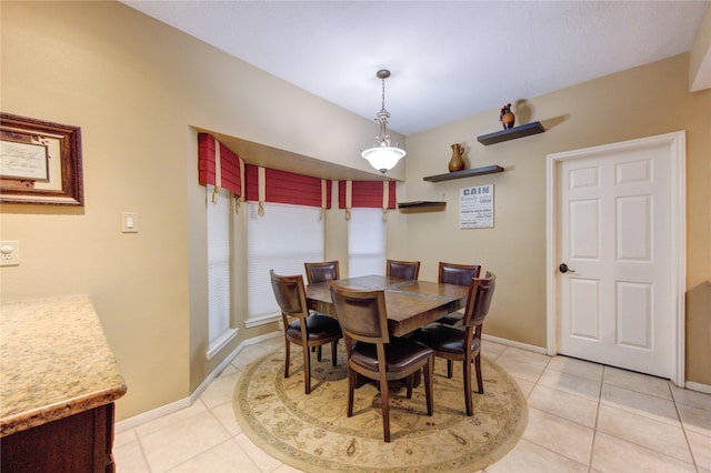 dining space featuring light tile patterned flooring