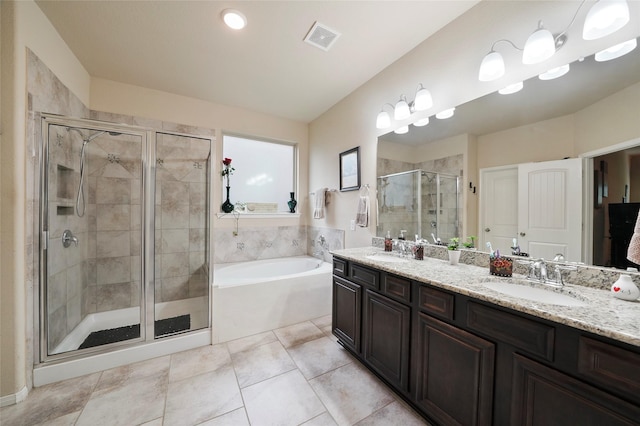 bathroom with tile patterned flooring, vanity, and plus walk in shower