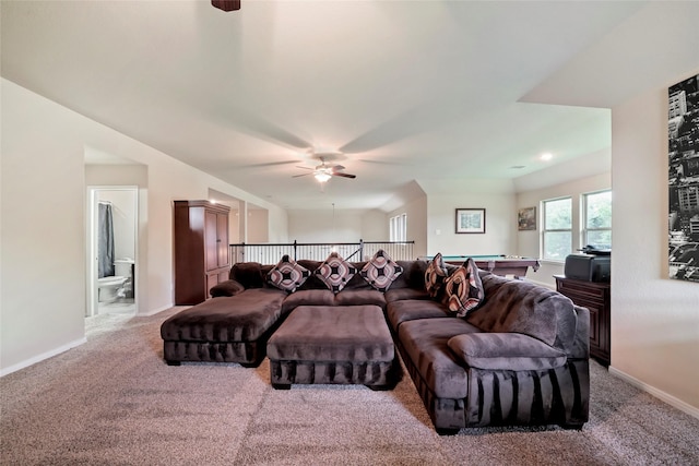 carpeted living room with ceiling fan and pool table