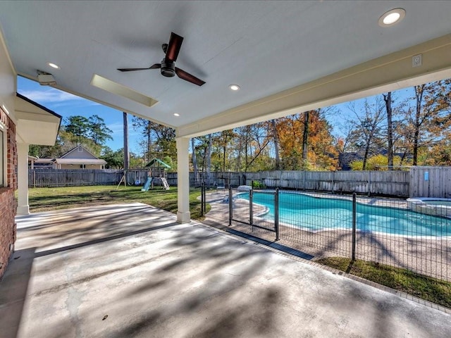 502 Crown Colony Dr, Lufkin, TX 75901 - view of pool featuring a patio area, a ceiling fan, a playground, and a pool with connected hot tub