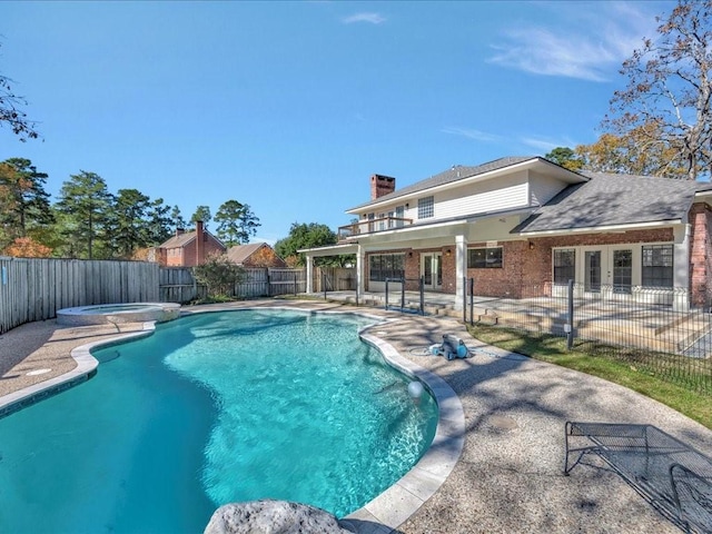 502 Crown Colony Dr, Lufkin, TX 75901 - view of swimming pool featuring a fenced backyard, a patio, french doors, and a pool with connected hot tub
