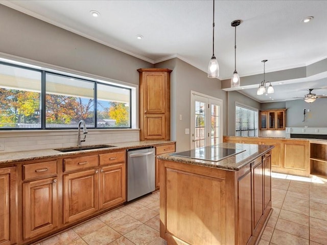 kitchen with dishwasher, a center island, plenty of natural light, and sink