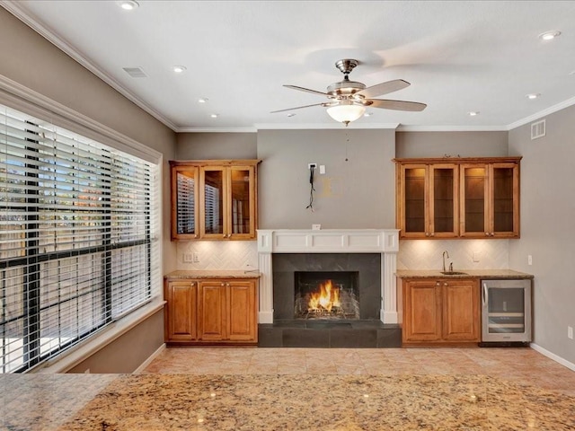 502 Crown Colony Dr, Lufkin, TX 75901 - unfurnished living room featuring wine cooler, wet bar, a ceiling fan, baseboards, and recessed lighting