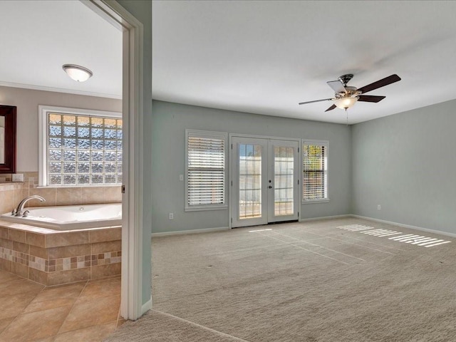 502 Crown Colony Dr, Lufkin, TX 75901 - unfurnished room featuring healthy amount of natural light, ceiling fan, french doors, and baseboards