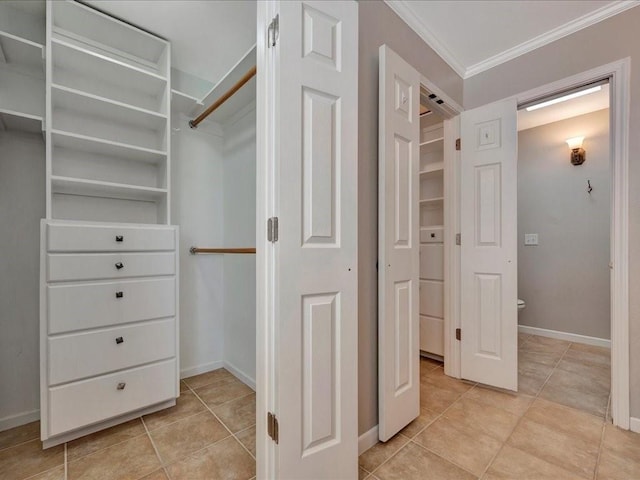 spacious closet with light tile patterned flooring