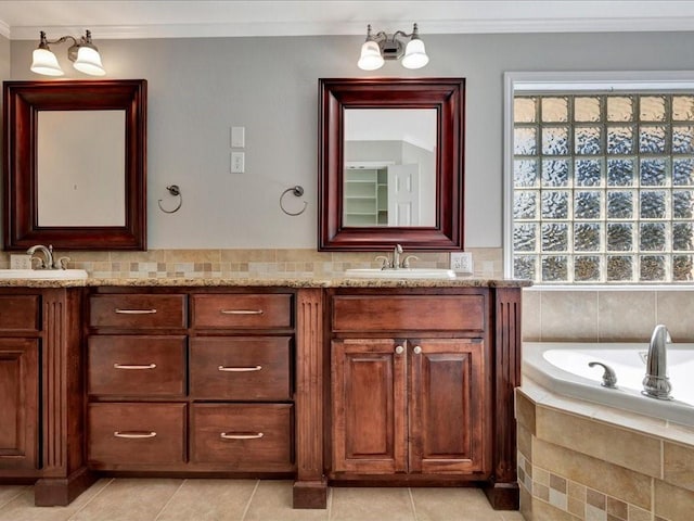 502 Crown Colony Dr, Lufkin, TX 75901 - bathroom with double vanity, crown molding, tile patterned floors, and a relaxing tiled tub