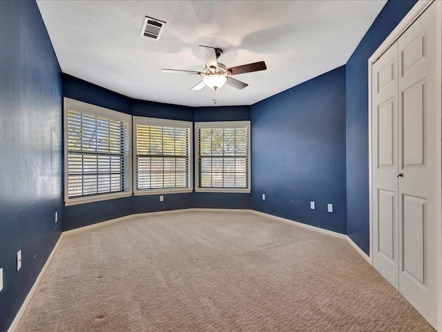502 Crown Colony Dr, Lufkin, TX 75901 - empty room with ceiling fan, carpet flooring, and baseboards