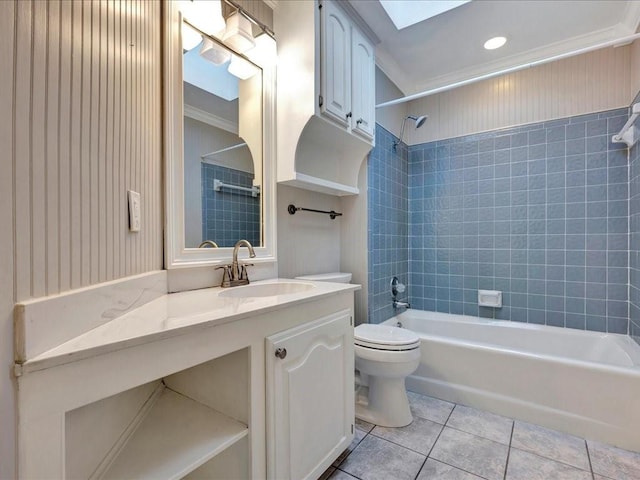 502 Crown Colony Dr, Lufkin, TX 75901 - full bathroom with tile patterned floors, toilet,  shower combination, vanity, and a skylight