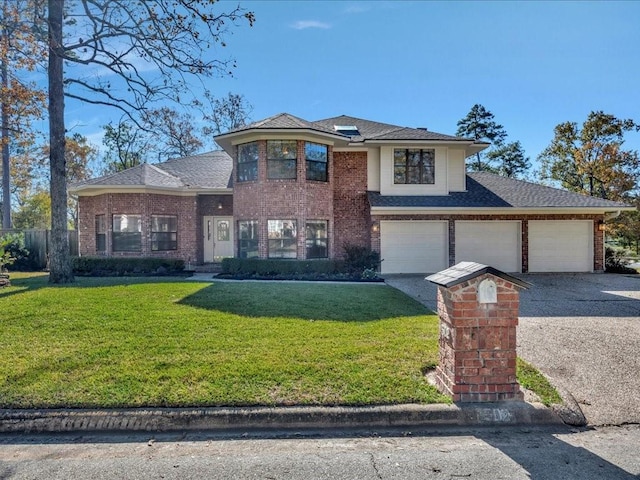 view of front property with a front yard and a garage