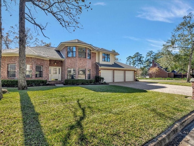 view of front of house with a front yard and a garage