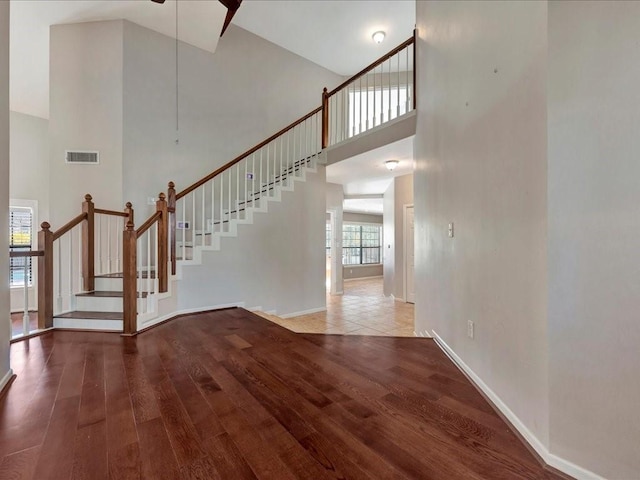 interior space with hardwood / wood-style floors and high vaulted ceiling