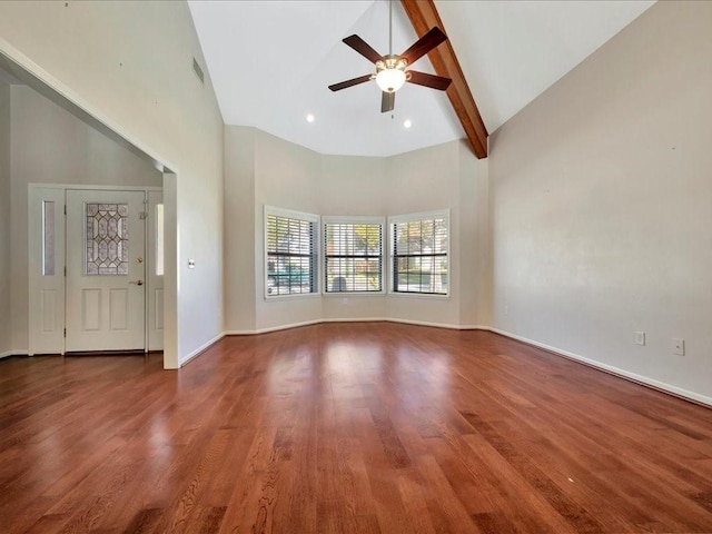 unfurnished living room with ceiling fan, beam ceiling, wood-type flooring, and high vaulted ceiling