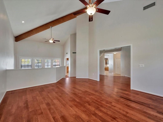 unfurnished living room with beamed ceiling, wood-type flooring, high vaulted ceiling, and ceiling fan