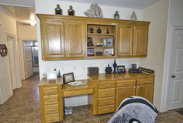 5256 County Road 469, Brazoria, TX 77422 - kitchen featuring brown cabinets and stone finish floors