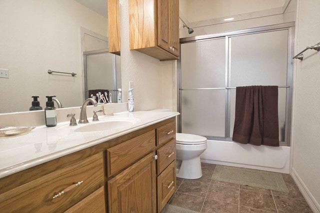 5256 County Road 469, Brazoria, TX 77422 - bathroom with vanity, toilet, enclosed tub / shower combo, and stone finish floors