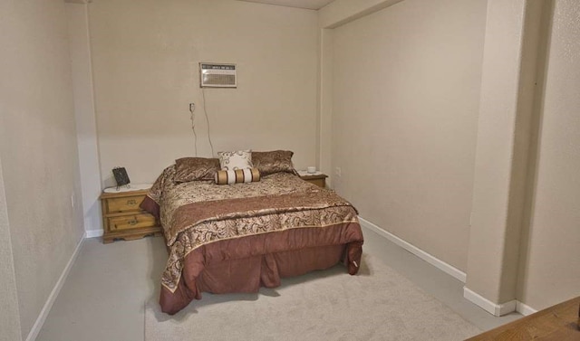 bedroom featuring light colored carpet and a wall mounted air conditioner