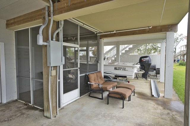 view of patio with a sunroom