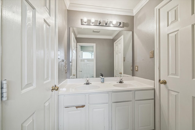 bathroom featuring crown molding and vanity