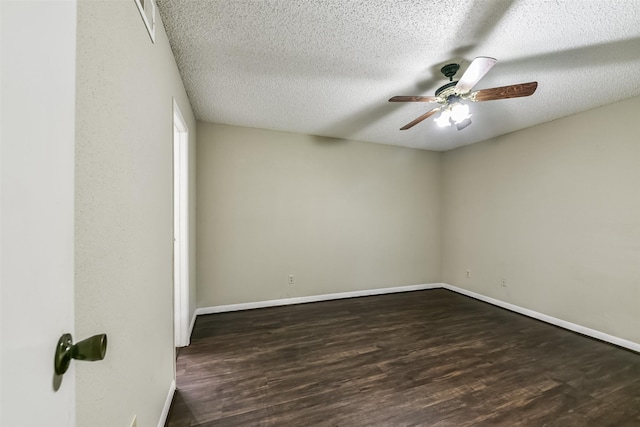 spare room featuring a textured ceiling, ceiling fan, and dark wood-type flooring