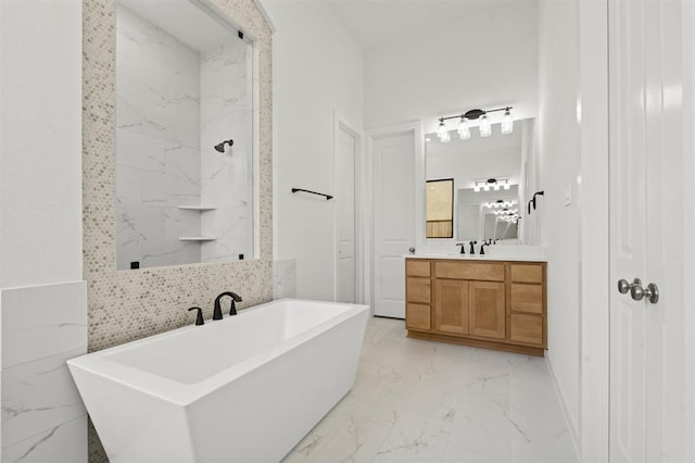 bathroom featuring tasteful backsplash, vanity, tile walls, and a bathtub