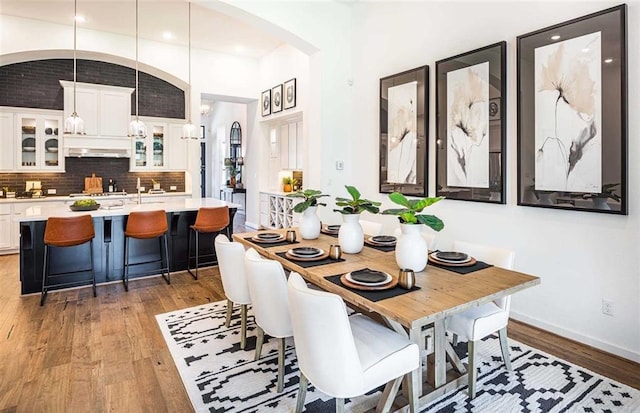 dining room with wood-type flooring