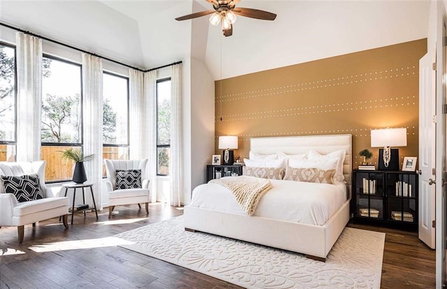 bedroom with lofted ceiling, ceiling fan, and hardwood / wood-style floors