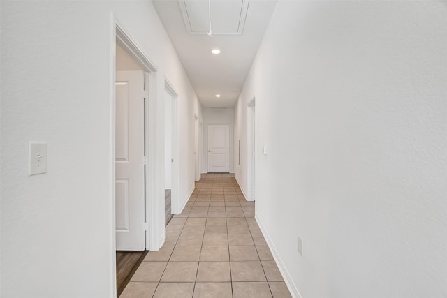 hallway with light tile patterned floors